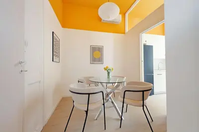 a dining room with a glass table and chairs at Elegance in Parioli Rome La casa di Pigi in Rome