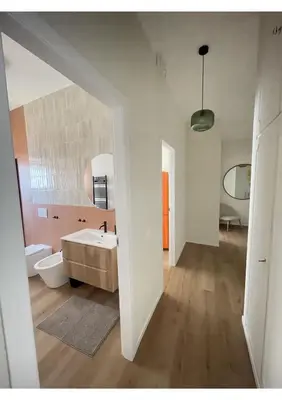 a white bathroom with a tub and a sink at Bonci Rooms - Appartamento in zona Policlinico Gemelli, Università Cattolica, Vaticano, Stadio Olimpico in Rome