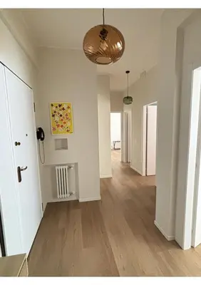 an empty room with white walls and wooden floors at Bonci Rooms - Appartamento in zona Policlinico Gemelli, Università Cattolica, Vaticano, Stadio Olimpico in Rome