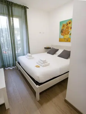 a bathroom with a shower and a toilet and a sink at GuestHouse Denina67 - ChiacchioPM in Rome
