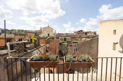 a view from a balcony with potted plants at Trastevere Romantic Nest in Rome