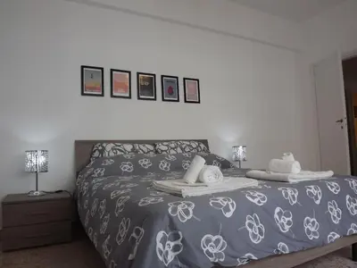 a bedroom with a bed with two towels on it at Casa Vacanze Kokoroma Cipro al Vaticano in Rome