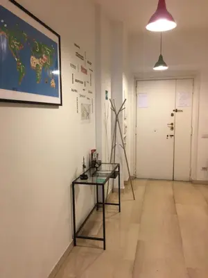 a room with a glass table and a picture on the wall at Casa Vacanze Kokoroma Cipro al Vaticano in Rome