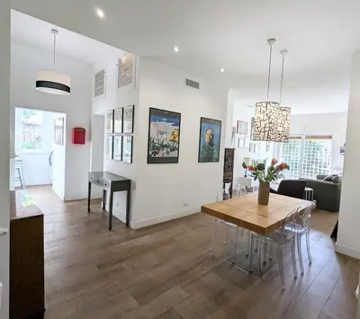 a living room with a table and a dining room at Casa Fabio - Cornelia Metro A in Rome