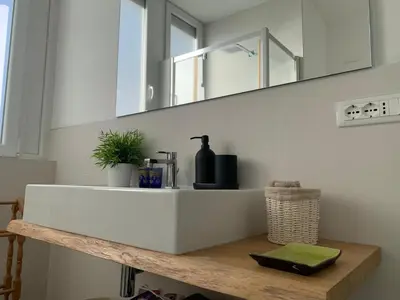 a bathroom with a white sink and a mirror at Casa Fabio - Cornelia Metro A in Rome
