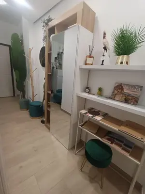 a room with a mirror and a desk and some plants at Gentile RHome Apartment, casa vacanze in Rome