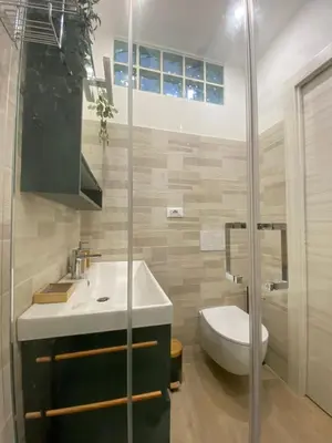 a bathroom with a toilet and a sink and a shower at Gentile RHome Apartment, casa vacanze in Rome