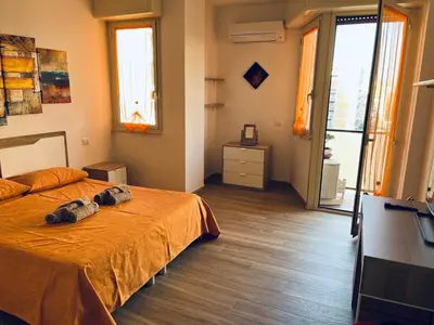 a bedroom with a bed with a dog laying on it at Tiburtina Family Apartment in Rome