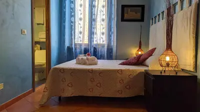 a bedroom with a bed with two stuffed animals on it at B&B Prati in Rome