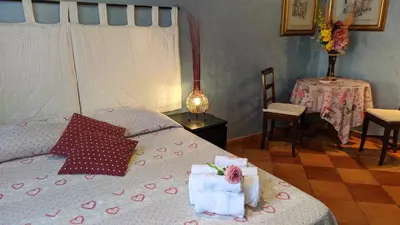 a bedroom with a bed with towels on it at B&B Prati in Rome