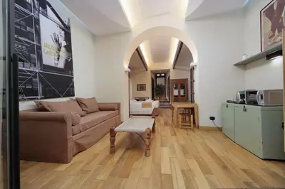 a living room with a couch and a table at Roma Suite Loft in Rome