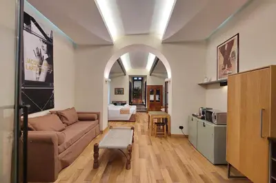 a living room with a couch and a table at Roma Suite Loft in Rome