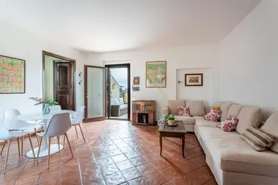 a living room with a couch and a table at iFlat Pantheon & La Dolce Vita Skyline Penthouse in Rome