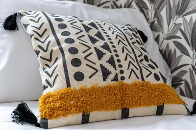 a pillow sitting on top of a bed at iFlat Pantheon & La Dolce Vita Skyline Penthouse in Rome
