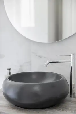 a black sink in a bathroom with a mirror at Suite23 , Roma in Rome