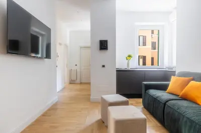 a living room with a couch and a tv at Suite23 , Roma in Rome