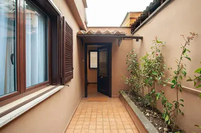 an empty hallway with a door and a window at Pied-à-terre Ponte Milvio in Rome