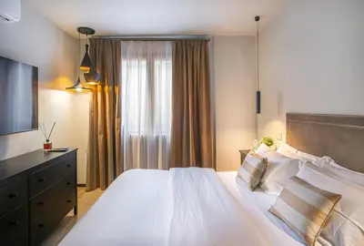 a microwave oven with a remote control in it at Pied-à-terre Ponte Milvio in Rome