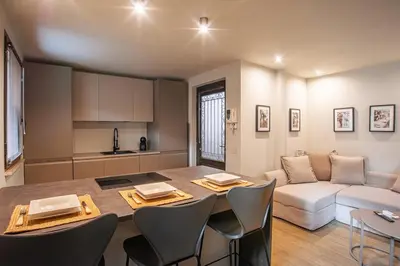 a kitchen counter with a drawer with donuts and a sink at Pied-à-terre Ponte Milvio in Rome