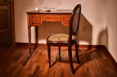 a wooden desk with a chair in front of a table at TreasureRome Trevi Private Palazzo in Rome