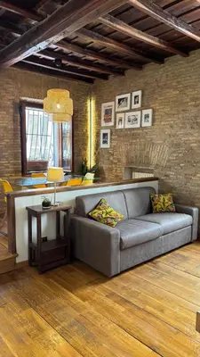 a living room with a couch and a table at Pantheon Private Apartment in Rome