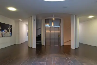 an empty hallway with a door in a building at Albertahaus in Rome