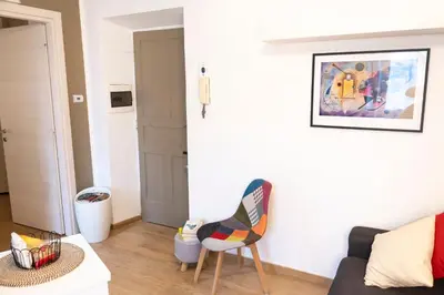 a living room with a couch and a chair at Licia House - Intero Appartamento - San Giovanni in Rome