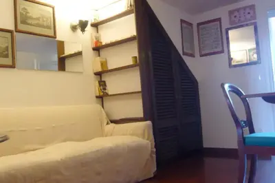 a living room with a couch and a chair at Laurina 4 - LOCAPPART in Rome