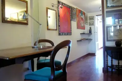 a room with a desk with a chair and a lamp at Laurina 4 - LOCAPPART in Rome