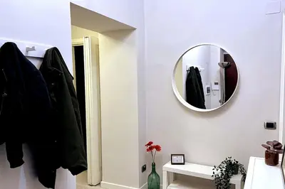 a bathroom with a mirror on the wall at Casa Amorello - Vaticano in Rome