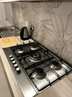 a kitchen stove top with a tea kettle on it at Casa Amorello - Vaticano in Rome