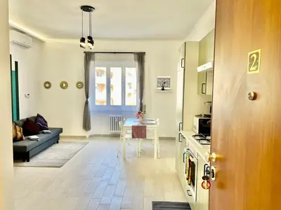 a living room with a couch and a table at Casa Vacanze Jenner in Rome