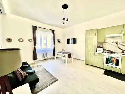 a living room with a couch and a table at Casa Vacanze Jenner in Rome
