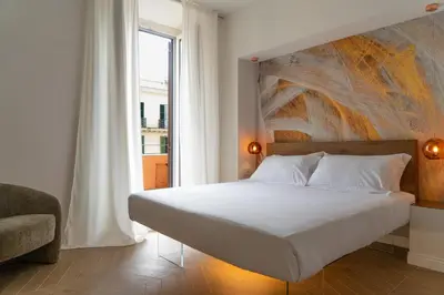 a bathroom with a sink and a mirror and towels at Gv Suite Collection - San Pietro Dome in Rome