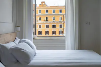 a room with a desk and a mirror at Gv Suite Collection - San Pietro Dome in Rome