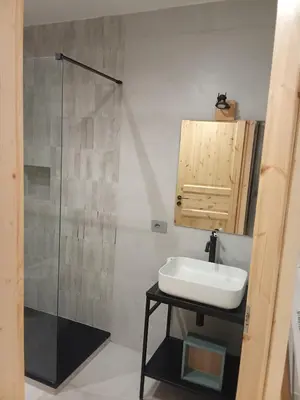 a bathroom with a sink and a glass shower at Studio Flat Rome Metro Garbatella in Rome
