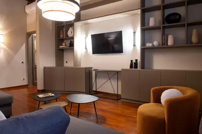 a living room with a couch and a tv at Pantheon Deluxe in Rome