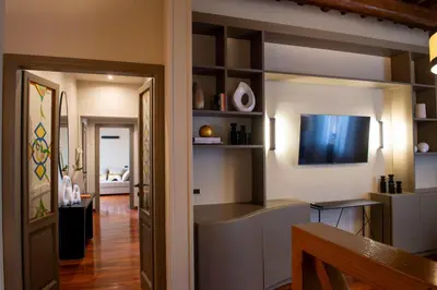 a living room with a television on a wall at Pantheon Deluxe in Rome