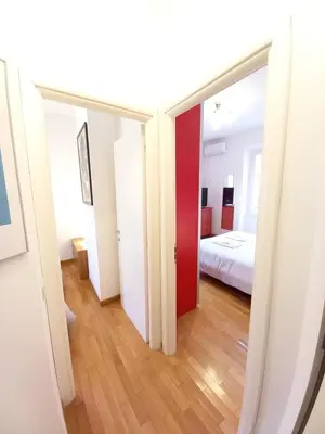 a room with a mirror and a bed at Rome center near Colosseum and metro a in Rome