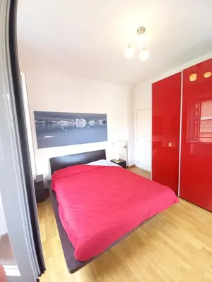 a bedroom with a red bed and a red closet at Rome center near Colosseum and metro a in Rome