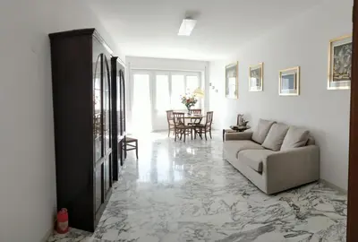 a living room with a couch and a table at La Casetta Di Nonna Anna - 120 mq Bright Apartment in Rome in Rome