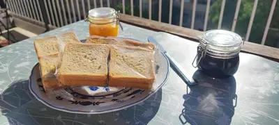 a plate with two slices of bread on a table at La Casetta Di Nonna Anna - 120 mq Bright Apartment in Rome in Rome