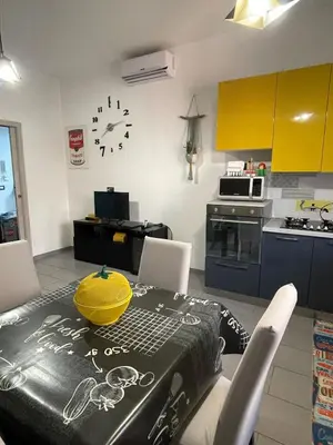 a kitchen with a table with a yellow bowl on it at Bittersweet Apartment in Rome
