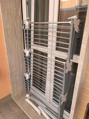 a cage is on a window in a room at Bittersweet Apartment in Rome