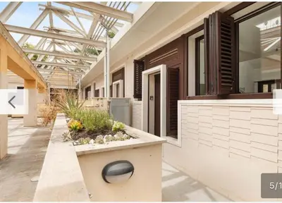 a house with a courtyard with a window at Trastevere City Life Apartments in Rome