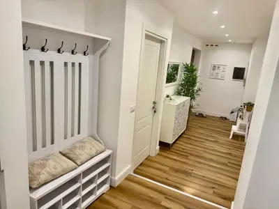 a hallway of a home with a door and wooden floors at Domus Antea in Rome