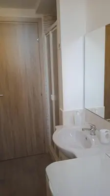 a bathroom with a white sink and a mirror at Danielas House in Rome