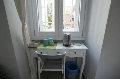 a desk in a room with a window at Camera con bagno in posizione strategica in Rome