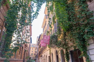 a street with ivy growing on the sides of buildings at LUXURY BABUINO -exclusive apartment in Rome