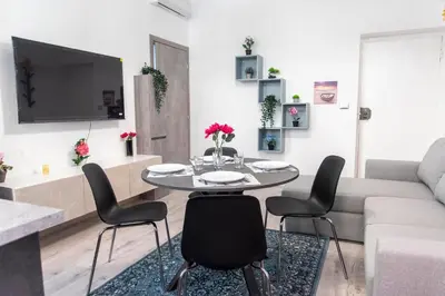 a living room with a table and chairs and a couch at LUXURY BABUINO -exclusive apartment in Rome